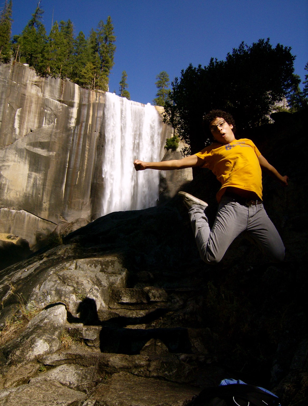 Jumping in front of a waterfall